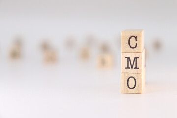 CMO acronym. Concept of Chief Marketing Officer written on wooden cubes isolated on white background