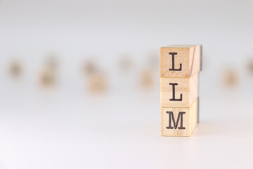 Abbreviation LLM. Concept of Large Language Model written on wooden cubes isolated on white background.