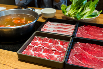 Beef and pork meat hot pot at the restaurant