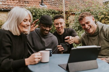 Friends having a video call with friends who could not attend the party