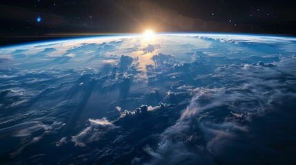 Stunning view of Earth from space showing clouds, sun rays, and a shimmering atmosphere.