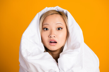 Photo of worried nervous lovely woman wrapped warm blanket isolated on yellow color background