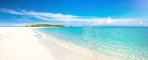 Sand spit of a tropical island stretching into the distance. Beautiful sunny summer landscape with white sand beach.