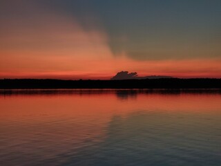 Naklejka premium sunset over the river