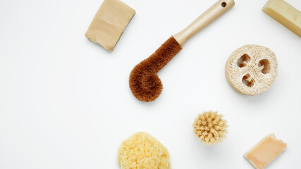 Natural organic eco cosmetics. Soap Eco, reusable cotton pads, loofah natural sponge washcloth, cotton swab, eucalyptus leaves on white background. Flat lay, top view, copy space