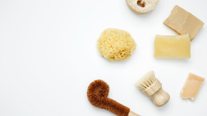 Natural organic eco cosmetics. Soap Eco, reusable cotton pads, loofah natural sponge washcloth, cotton swab, eucalyptus leaves on white background. Flat lay, top view, copy space