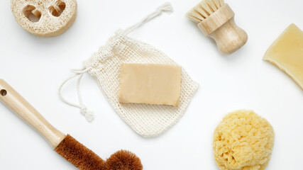 Natural organic eco cosmetics. Soap Eco, reusable cotton pads, loofah natural sponge washcloth, cotton swab, eucalyptus leaves on white background. Flat lay, top view