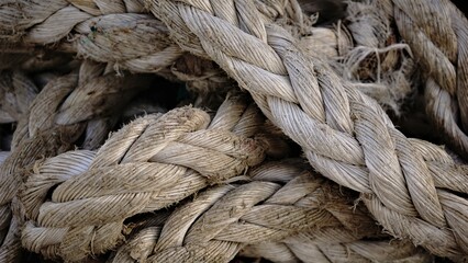 texture of stacked worn industrial ropes