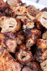 Food being grilled on skewers, creating a delicious Souvla recipe over charcoal