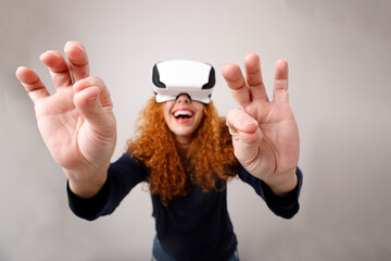 close-up hands of smiling woman with virtual reality goggles