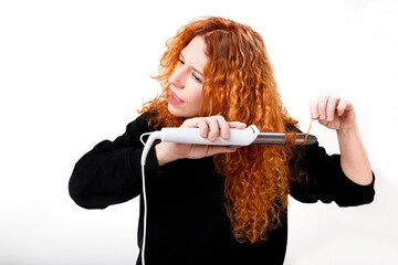 curly-haired woman with curling iron