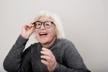older gray-haired woman with a surprised expression