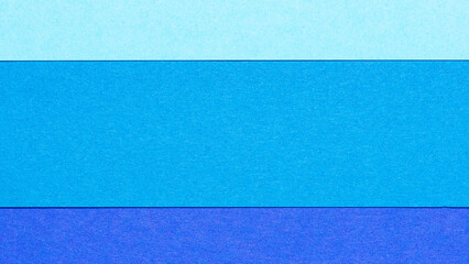 Colorful blue layered paper cardboard background, colors with layers and texture, backdrop with...