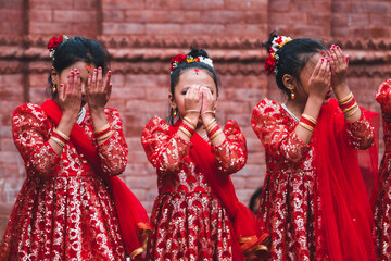 little girls performing a traditional nepalese dance on street