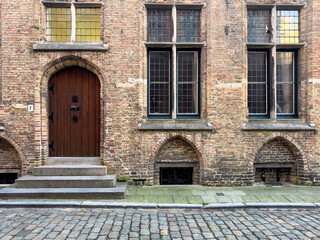 Street view of the famous touristic city of Belgium, Bruge, and its houses with classical medieval...