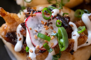 Bao buns with chicken and mushrooms close-up
