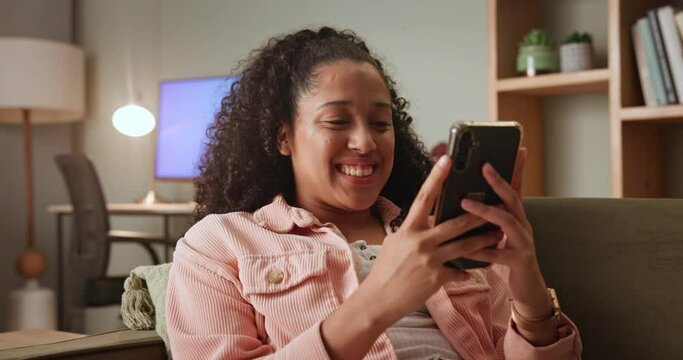 Girl, home and happy in sofa on smartphone and smile for social media post and entertainment. Female person, lounge and couch on internet for streaming service, news update and funny video or memes