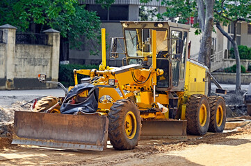 Grader on road construction site