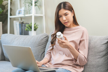 Wellness and dieting asian young woman, girl working from home using computer, typing or searching...
