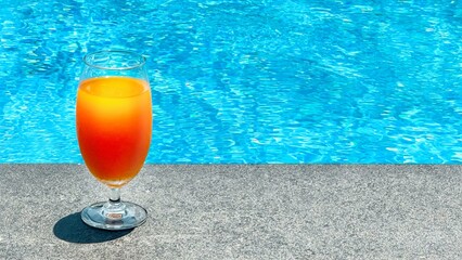 Summer holidays. Vibrant, no alcohol, fruit cocktail sits by sparkling pool, evoking leisure and vacation vibes. Perfect for summer relaxation, it inspires dreams of sunny poolside days. Copy space