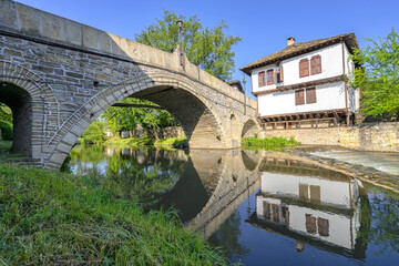 The old bridge and traditional Bulgarian houses in the old town of Tryavna, Bulgaria