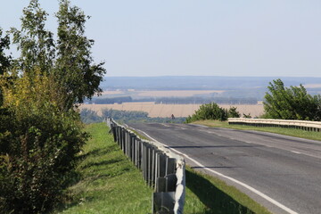 road among wheat fields