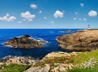 Summer ocean island Pancha coastline landscape with lighthouse (Spain).