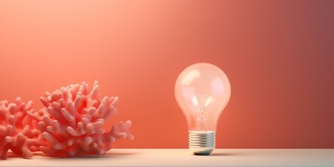 Coral backdrop with illuminated lightbulb on a white platform symbolizing ideas and creativity business concept creative thinking innovation new idea coral 