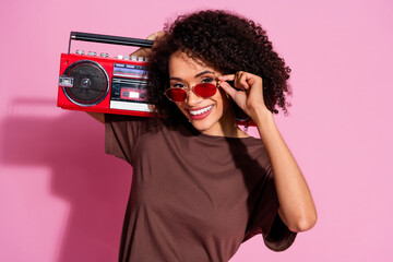 Photo of nice lovely cheerful girl wear brown trendy clothes hold radio isolated on pink color background