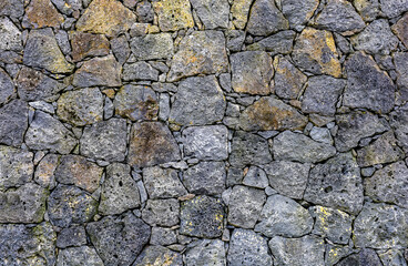 Fundo natural de imagem formado por um parede de rochas basalticas