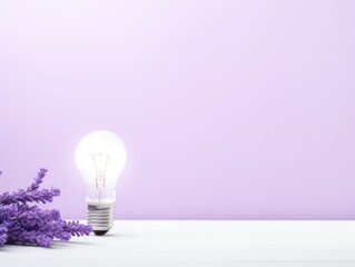Lavender backdrop with illuminated lightbulb on a white platform symbolizing ideas and creativity business concept creative thinking innovation new idea