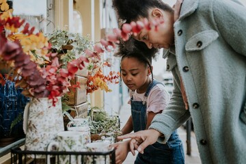 Little girl shopping with mum