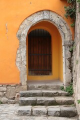 Fototapeta na wymiar A classic-styled arched doorway set in a vibrant orange wall, inviting a sense of curiosity and history