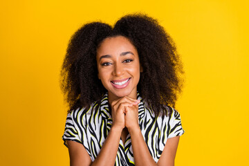 Portrait photo of young sweet lovely girlfriend smiling cute in zebra print shirt with beautiful curly hair isolated on yellow color background