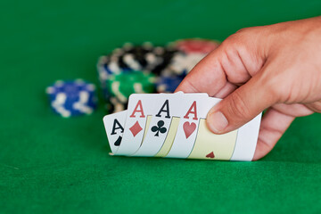 Hand with 4 aces in casino