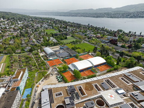 Aerial view of Swiss City of Z&uuml;rich with Lake Z&uuml;rich in the background on a cloudy spring afternoon. Photo taken April 30th, 2024, Zurich, Switzerland.