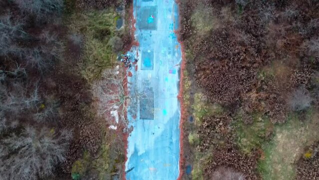 Aerial top down of graffiti road in Fall around abandoned coal town Centralia Pennsylvania