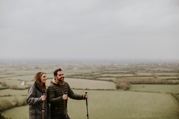 Couple trekking on mountain together
