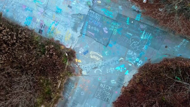 Aerial top down of graffiti road in Fall around abandoned coal town Centralia Pennsylvania