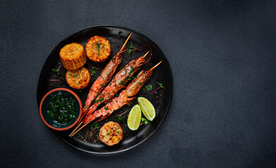 langoustines on skewers, shrimp kebab, with fried corn, spices and herbs, homemade, no people,