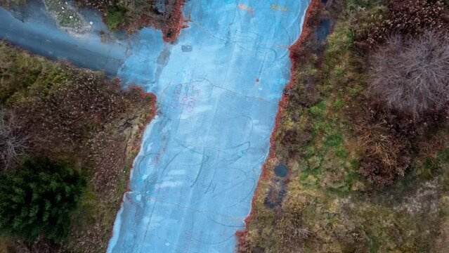 Aerial top down of graffiti road in Fall around abandoned coal town Centralia Pennsylvania