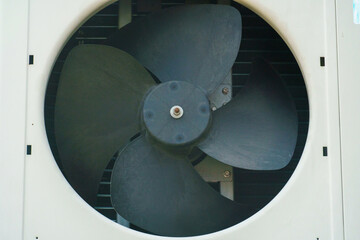 Outdoor air conditioning unit. A large modern air conditioner on the wall of an apartment building....