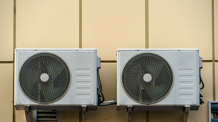 Outdoor air conditioning unit. A large modern air conditioner on the wall of an apartment building. Repair and maintenance of the air conditioning system