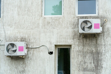 Outdoor air conditioning unit. A large modern air conditioner on the wall of an apartment building....