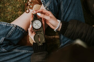 Woman hand holding compass photo