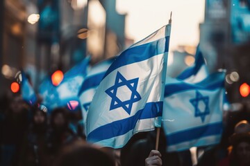Israeli flags in hands, at a demonstration in honor of Israel's Independence Day