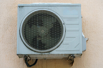 Outdoor air conditioning unit. A large modern air conditioner on the wall of an apartment building. Repair and maintenance of the air conditioning system