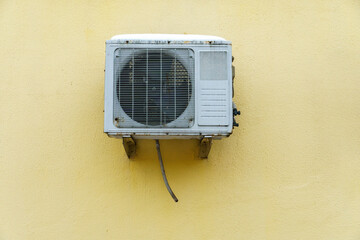 Outdoor air conditioning unit. A large modern air conditioner on the wall of an apartment building. Repair and maintenance of the air conditioning system