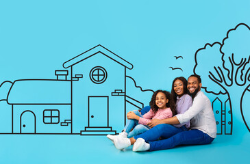 A cheerful African American family, consisting of a father, mother, and young daughter, sits closely snuggled and embracing. Behind them, a simplistic illustration of a house on blue background