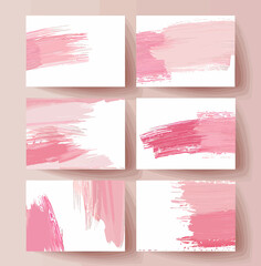 a set of four pink paint strokes on white paper